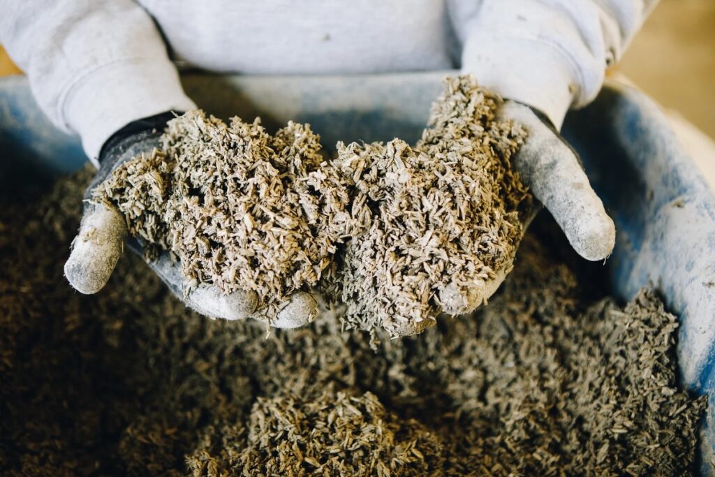 Photo from Hempitecture (https://www.hempitecture.com/wp-content/uploads/2024/01/hempcrete-mixed-is-a-sustainable-building-material.webp)