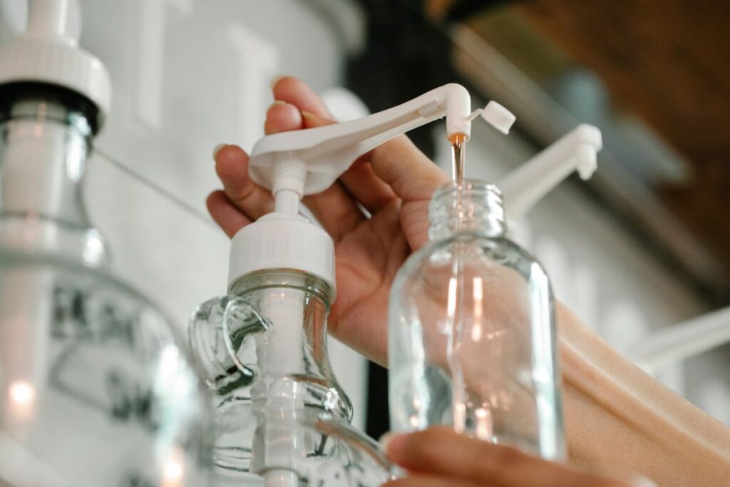 Customer refilling body wash in a shop